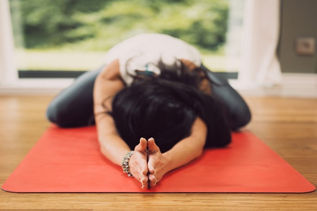 fertility yoga for PCOS
woman on yoga mat in extended childs pose