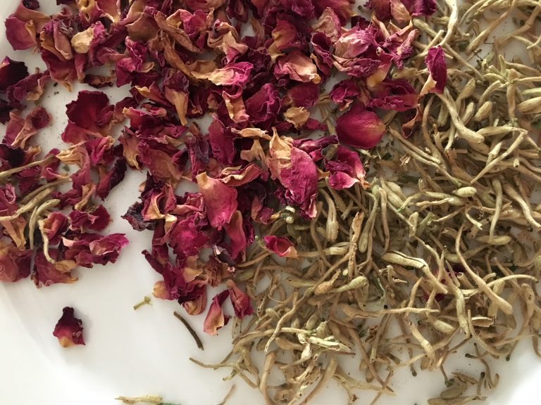 Beautiful facial mask with honeysuckle and rose flowers