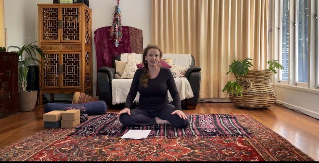 woman practicing yoga in her home